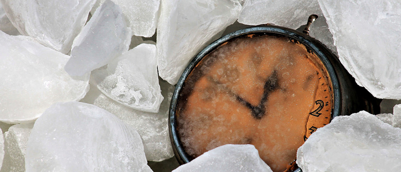 Clock covered by ice cubes