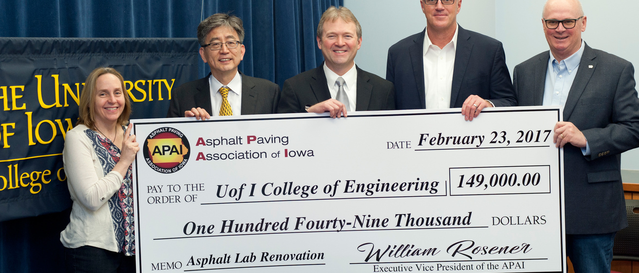 Photo of five people holding a large check made out to the UI College of Engineering