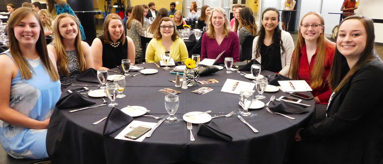 Engineering students sitting together at a table during the awards banquet