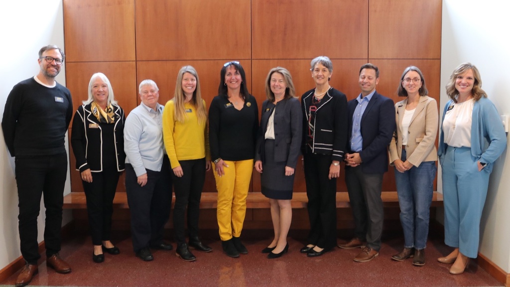 Advisory board members pose for a photo with Dean Ann McKenna